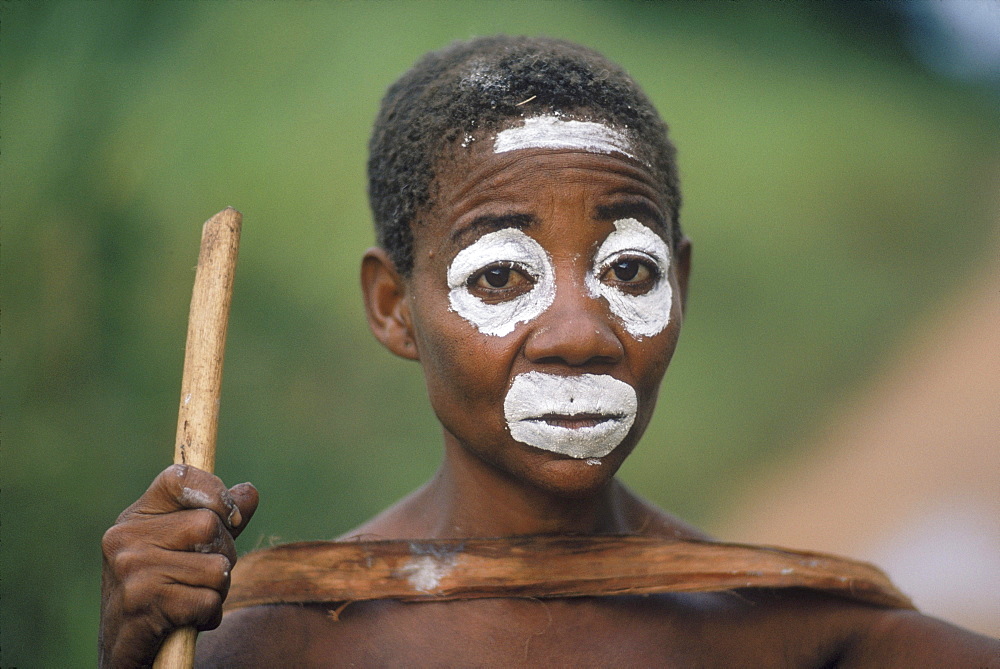 Republic of Congo (formerly Zaire) Ituri Forest. Pygmee woman with painted face.