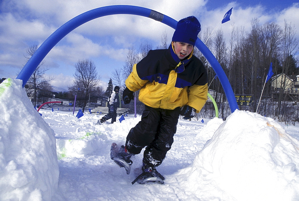 Young snowshoer in an obstacle course in Stowe, Vermont.