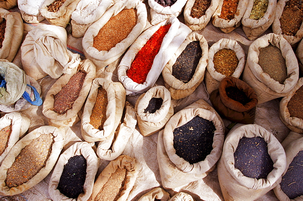 A spice merchant displays his wares in Yarkant, a remote city in far western China which seldom encounters Western travelers.