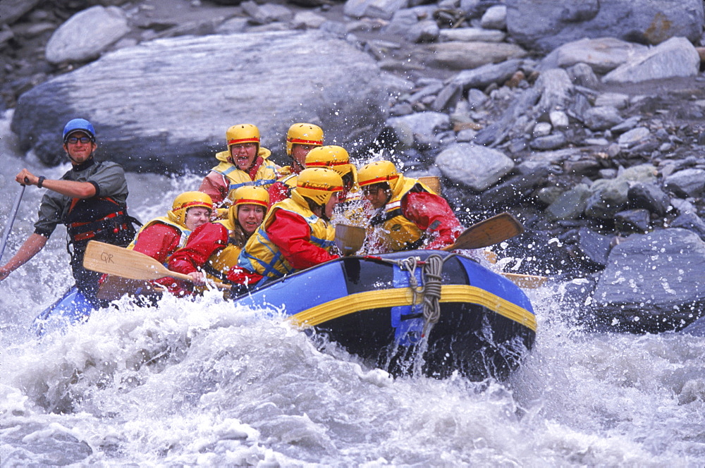 Rafters make their way through Class IV rapids outside of Queenstown on the South Island of New Zealand.