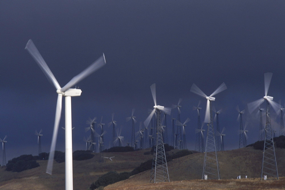 Hightech windmills, some standing 500 feet high when their blades are vertical, hum on the Altamont Pass of California as they produce clean electricity.