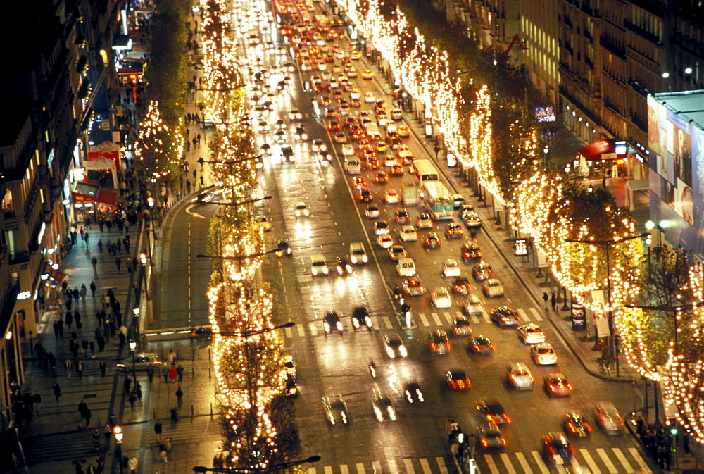 Paris' most famous avenue, Avenue des Champs Elysees, as seen from the top of the Arc de Triomphe at night, Paris, France