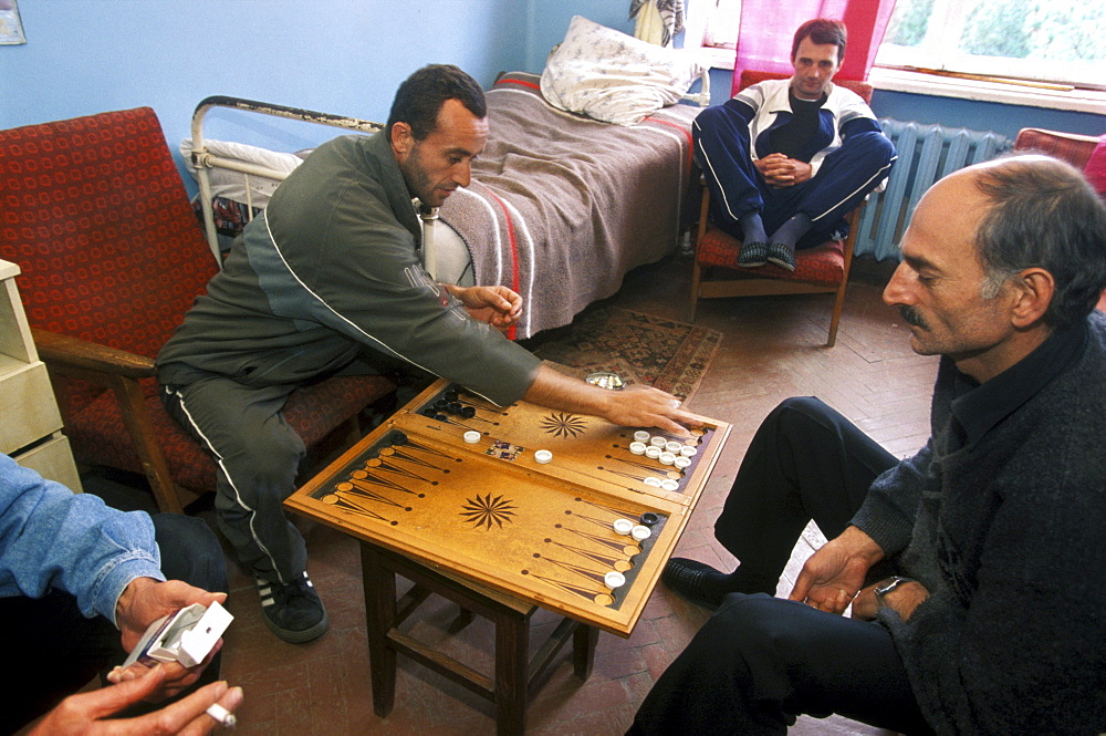 Men with the MDR (Multi Drug Resistant) form of tuberculosis, play backgammon in one of their rooms in Gulripsch Hospital, Abkhazia.