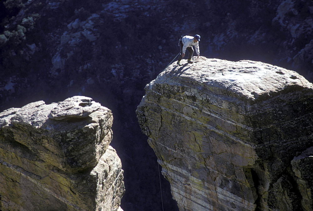 A rock climber in the Windy Point area of the Santa Catalina Mountains, north of Tucson, Arizona