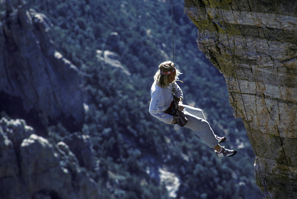 A rock climber in the Windy Point area of the Santa Catalina Mountains, north of Tucson, Arizona