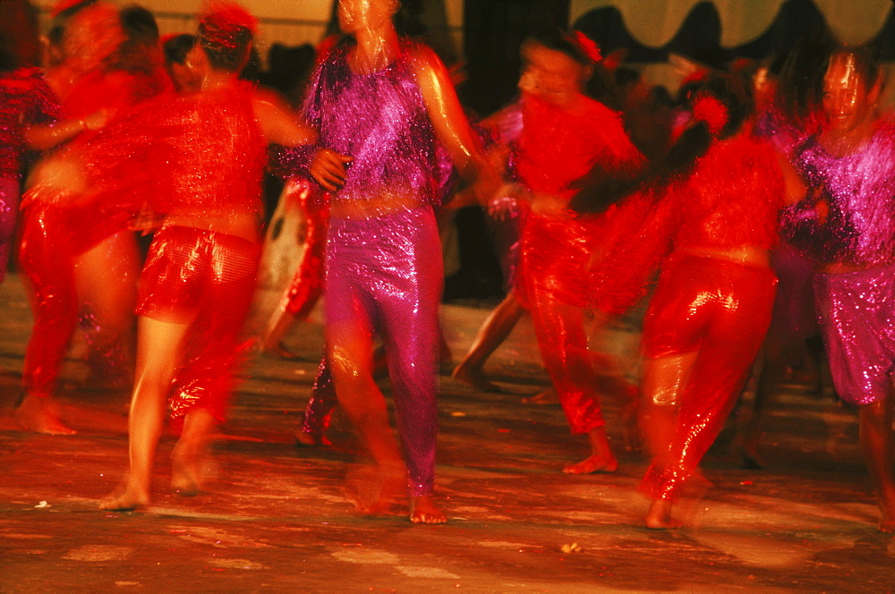 In Tahiti, hundreds of traditional dancers perform in the streets of Papeete the capitol during a Halloween celebration.