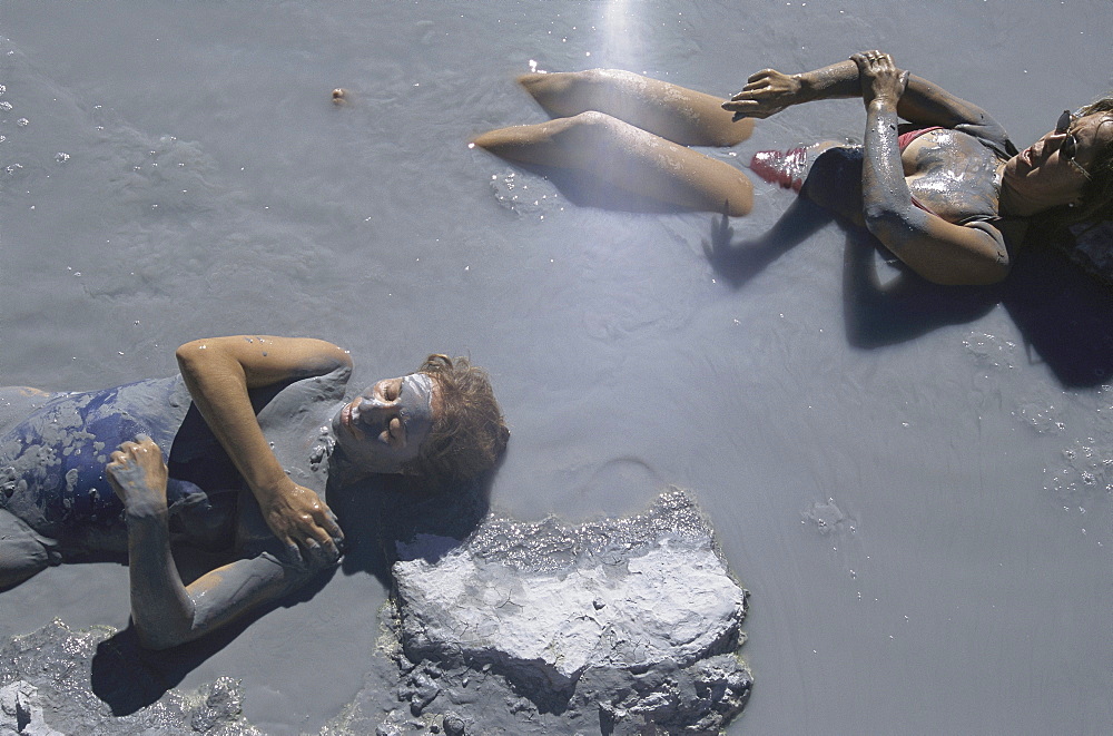 Bathers in mud at Las Maquinitas near Copahue, Argentina. Margarita Nievas, 56, blue and Susana Nievas, 48 are sisters. Both are from Neuquen and come here 2 or 3 times a year for one week just for prevention.