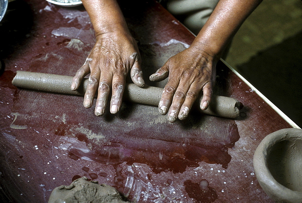 A Pueblo Indian potter makes pottery using traditional hand techniques, Santa Clara Pueblo, New Mexico