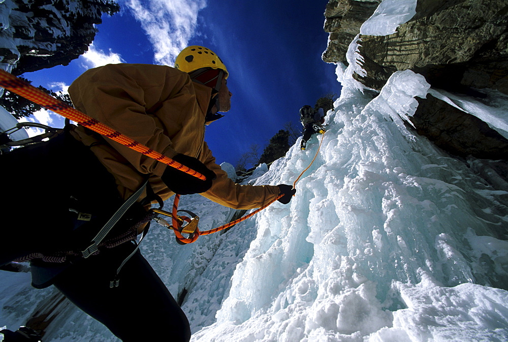 Jamie Blythe climbing the Trestle Wall WI3 Ouray Ice Park, Mike Seamens belays, Colorado