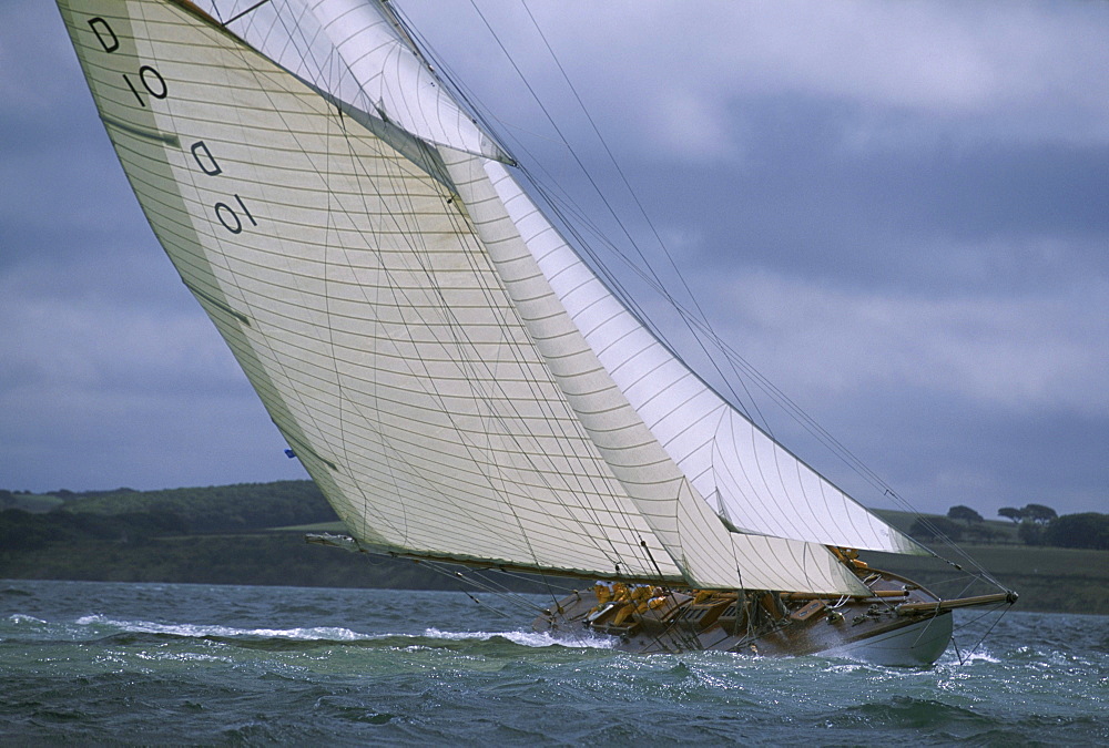 A beautiful classic yacht, an 85' gaff rigged sloop races in the America's Cup, where the dark skies of Cowes, England predict stormy seas.