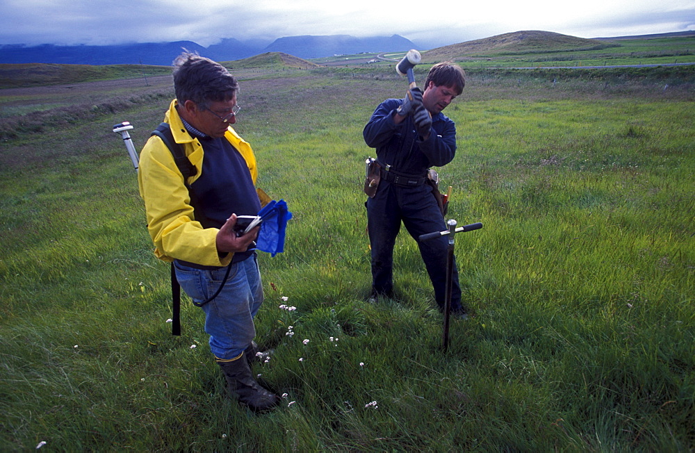 American archeologists, Antonio Gilman and John Steinberg, take a core sample in a farmer's field near Glaumbaer in northcentral Iceland. Steinberg made an important discovery in Glaumbaer in 2001. He found the homestead of Thorfinn Karlsefni, the father of the first European born in the New World. This find has important implications for Viking history.