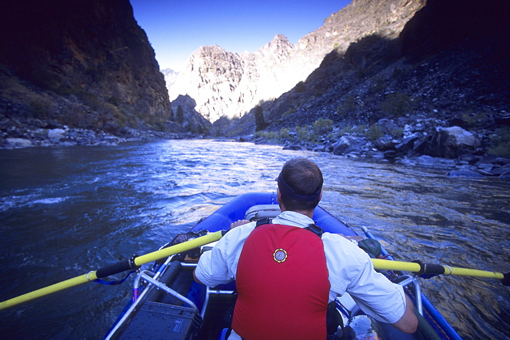 Stan Czarniak rafts through Impassable Canyon on a descent of the Middle Fork Of The Salmon River, Frank Church-River of No Return Wilderness, Idaho.