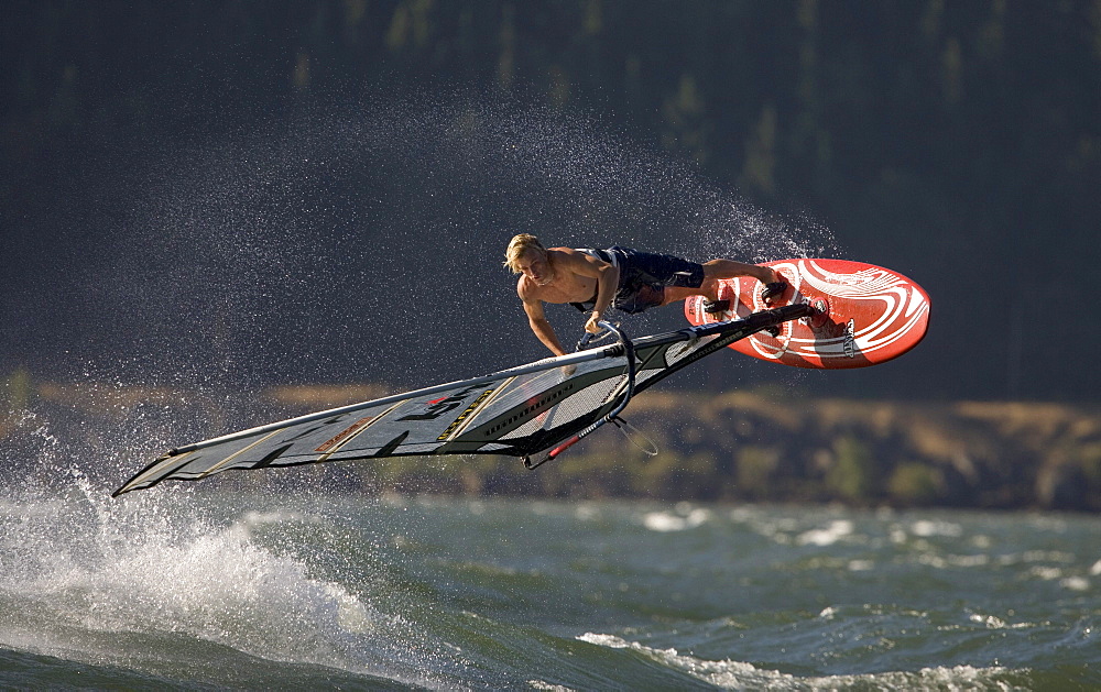 Rob Warwick lets it all hang out, performing a "Shove It" at The Hatchery, Hood River, Oregon