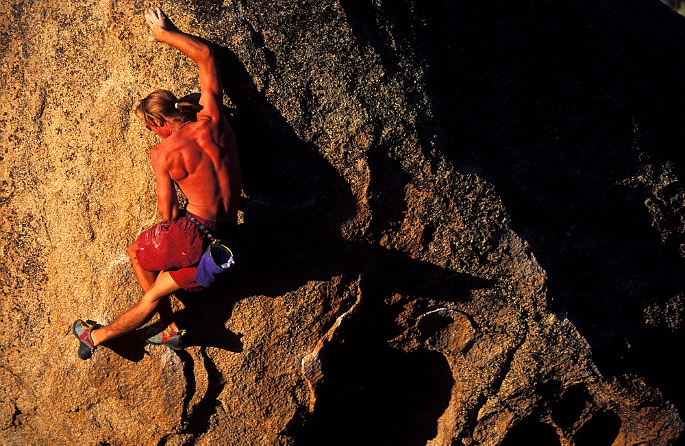 Dwight Duke about to step up on a bouldering problem in the Buttermilks near Bishop, California.