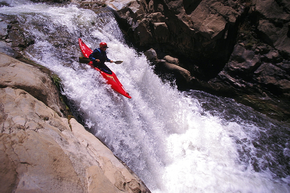 Bill Russell lines up his kayak perfectly over some falls on the Kern River, near Kernville, California.