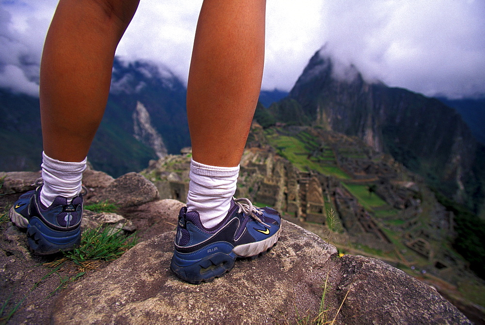 Hanh Quach looking out at the clouds over Machu Pichu in Peru.