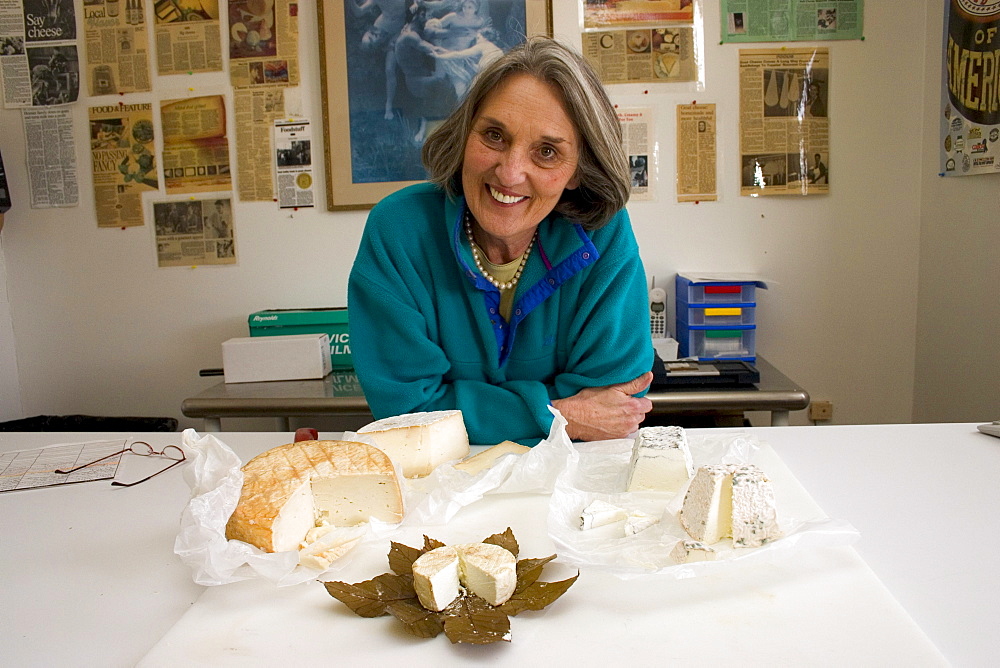 Judy Schad of Capriole, Inc, one of America's top cheesemakers, located in Greenville, Indiana poses with some of her goat cheeses