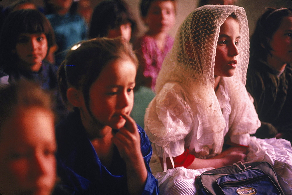 Tajik girls study in a rural school, without windows, desks or chairs, in the Panjshir Valley, Afghanistan.  The Panjshir Valley, which was a stronghold for Tajik commander Achmed Shah Masood, was heavily bombed during the Soviet occupation of Afghanistan, but much has now been rebuilt.