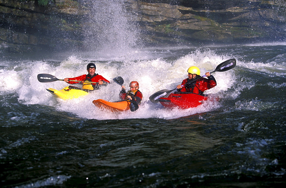 Eric Jackson, one of the happiest dads around, surfing his favorite hole with his kids Emily and Dane on the Caney Fork River in Rock Island, Tennessee.