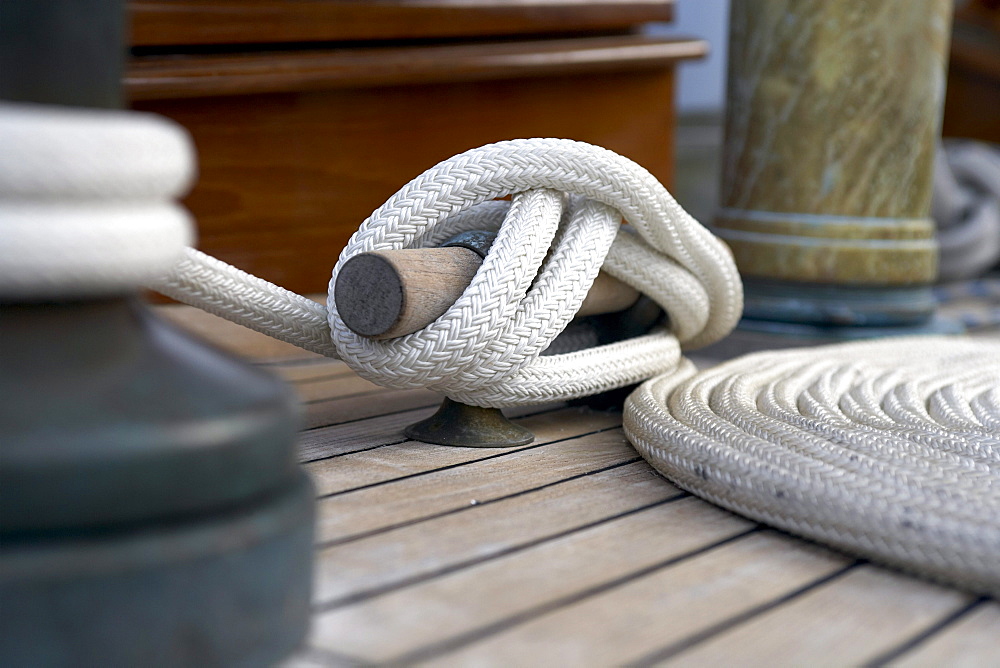 Winch, cleat and coil, on deck of sailing yacht "Sincerity."