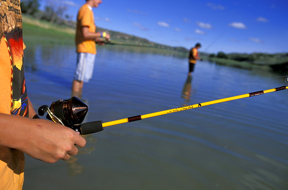 Boy Scouts  from troop  fishing during a break from canoeing on the Lewis and Clark trail on the Upper Missouri River in Montana.