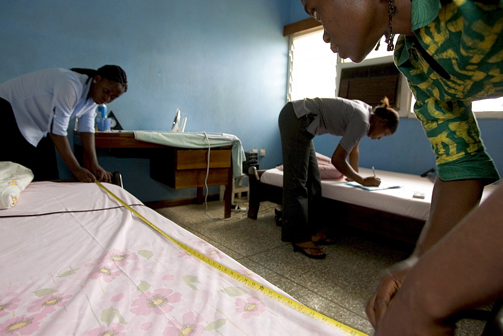 Research assistants and technicians from the University of Ghana collect dust samples from the living rooms and bedrooms of  children in Accra, Ghana.  The samples will be analyzed for the presence of dust mites, fungus', and animal allergens to help researchers better understand why children in wealthier homes have higher rates of allergies and asthma than poorer children.  The leading theory is that higher rates of helminth (parasite) infections among poorer children are affecting the immune system in a way that offers protection from allergies and asthma.  The study aims to find out what the worms are doing, isolate the beneficial effect and replicate it.