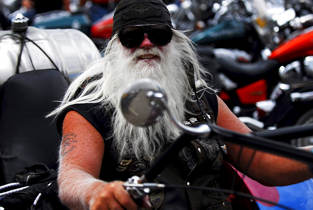 A white bearded rider at Sturgis Motorcycle Rally in South Dakota 2006.