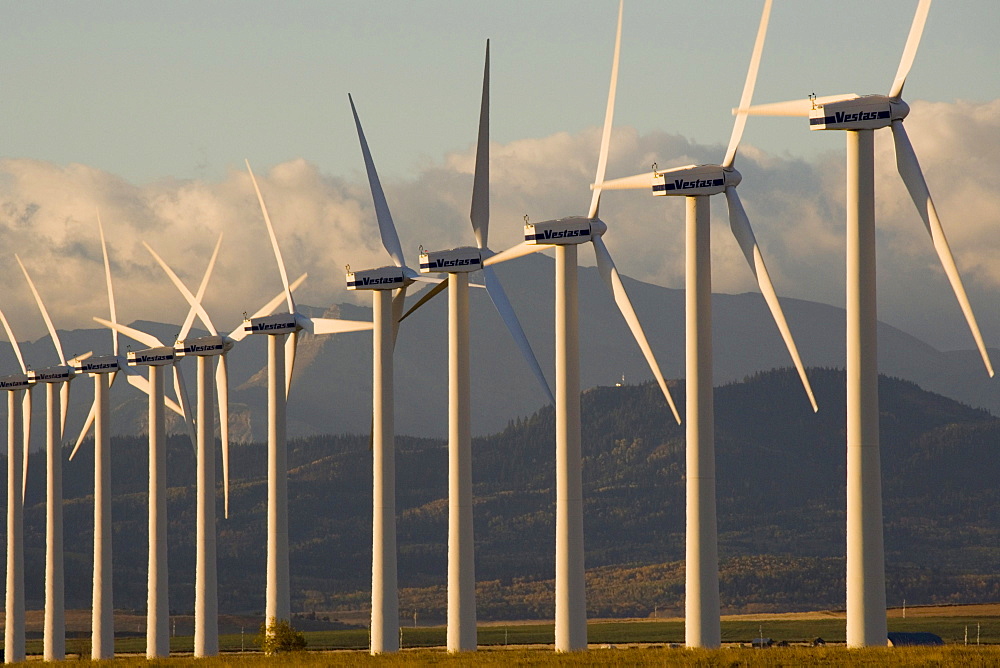 Windmills used for power generation at sunrise, near Pincher Creek, Alberta, Canada.