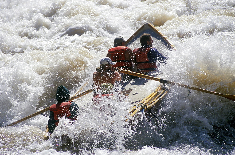 A wooden dory running Lava Falls Rapid, Grand Canyon National Park, Arizona.