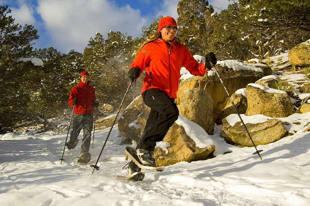 Man and Woman running on snowshoes, Ridgway Colorado