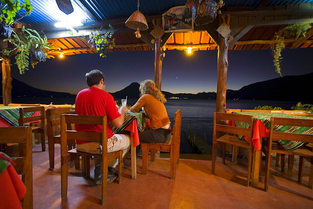 A couple eating dinner in Panajachel, Gautemala.