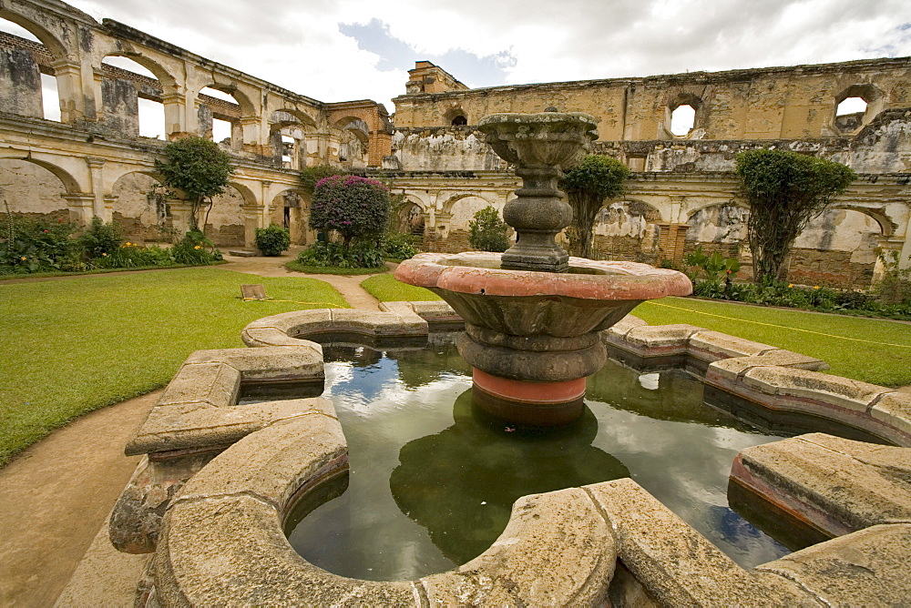 A fountain in a courtyard of the ruins of the old church Santa Clara, Antigua, Guatemala