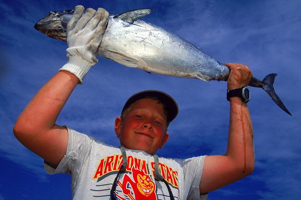 Jonathan Doss shows 11 pound Bonita he caught competing in Alabama Deep Sea Fishing Rodeo