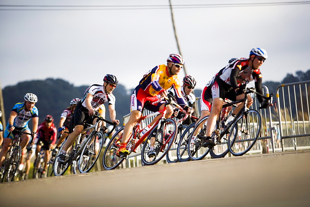 A pack of cyclists round the corner in Del Mar, CA.