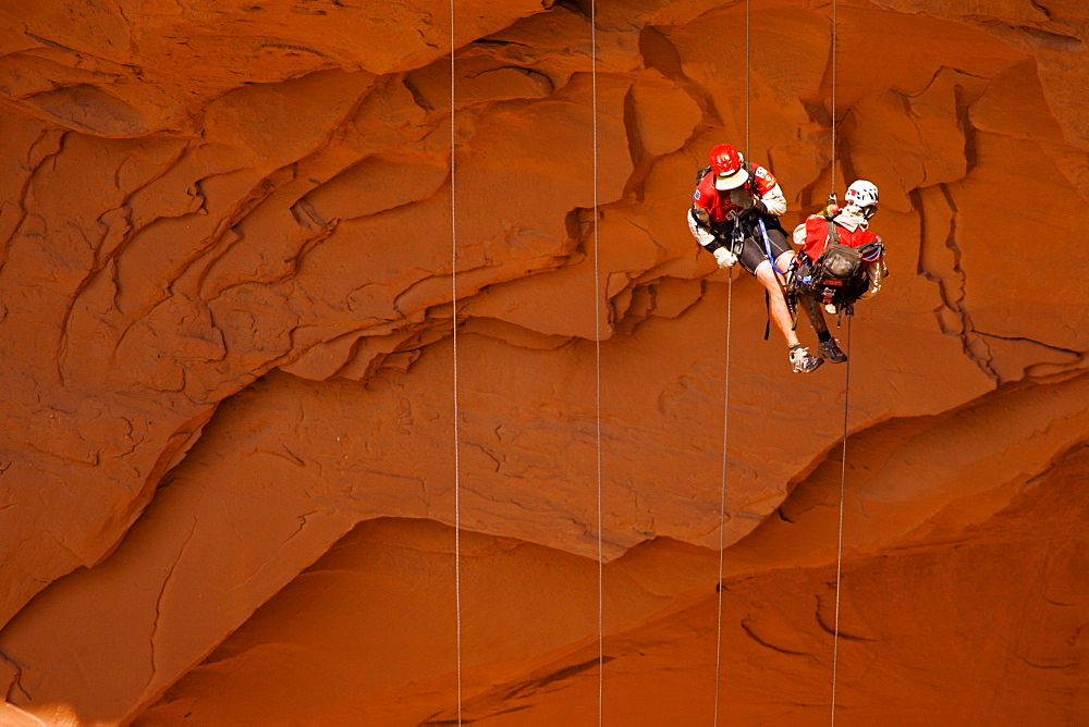 Two people rappelling during an adventure race near Moab, Utah.