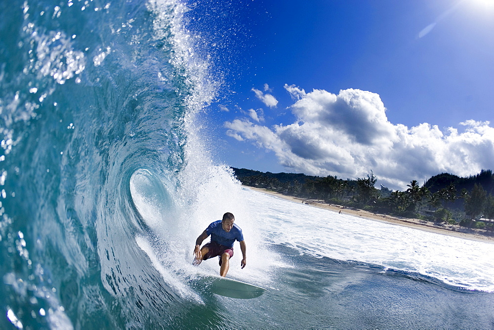 Music Star; Jack Johnson surfing in Hawaii