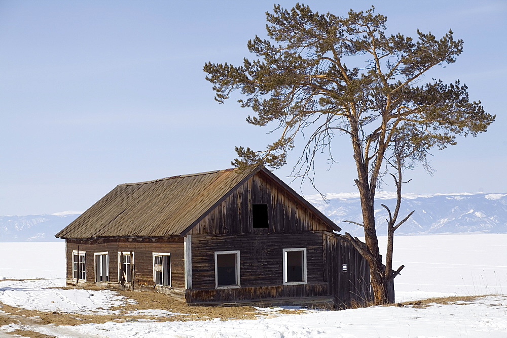 A house during the winter on the shore of Lake Baikal on Olkhon Island, Siberia, Russia.