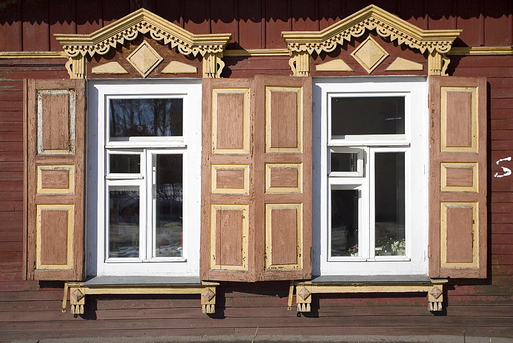 A set of windows from a traditional wooden home in Irkutsk, Siberia, Russia.