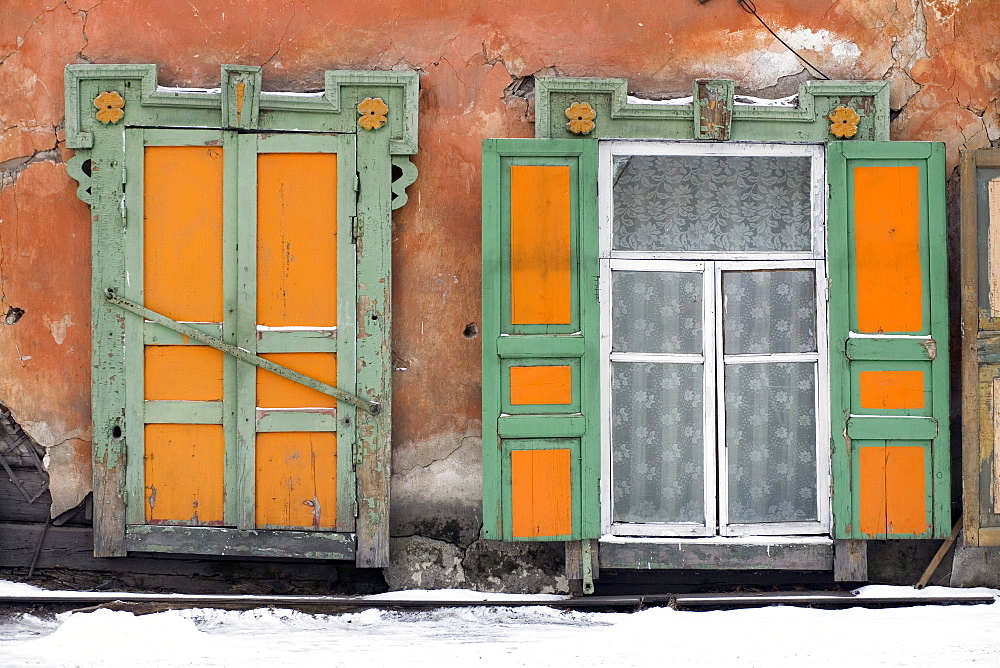 A set of windows from a traditional wooden home in Irkutsk, Siberia, Russia.