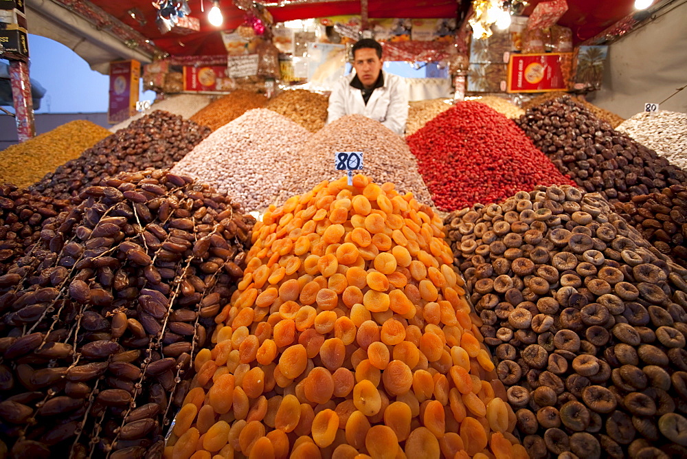 Dates, peaches, and nuts are sold by a street vendor in Marrakesh, Morocco.