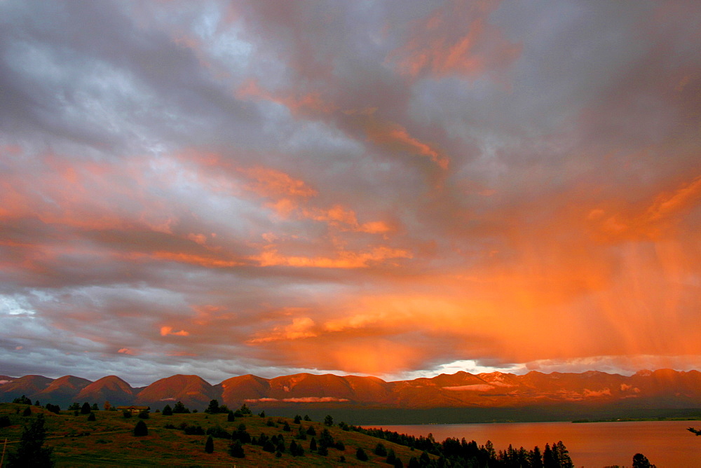 A pink sunset over Polson Bay on Flathead Lake near Polson, Montana.