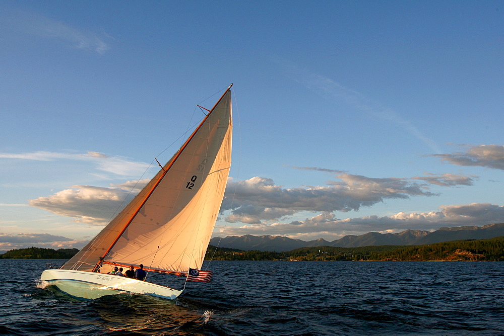 Guest at The Flathead Lake Lodge near Bigfork, Montana sail on the Questa a 51' Q-Class racing boat build in 1928.