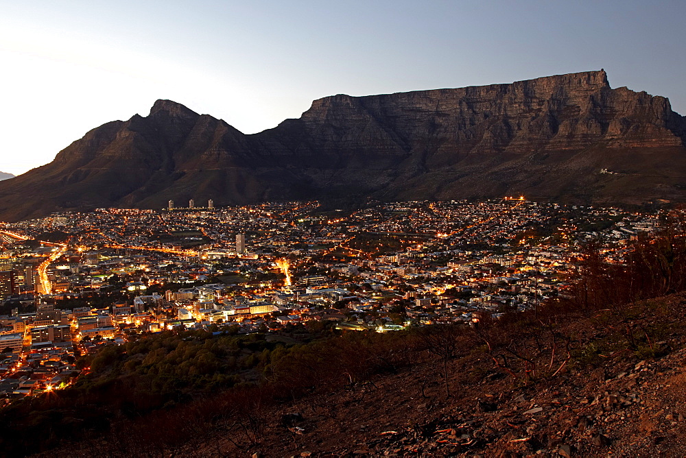 A view of Cape Town and Table Mountain from Signal Hill just before sunrise. South Africa.