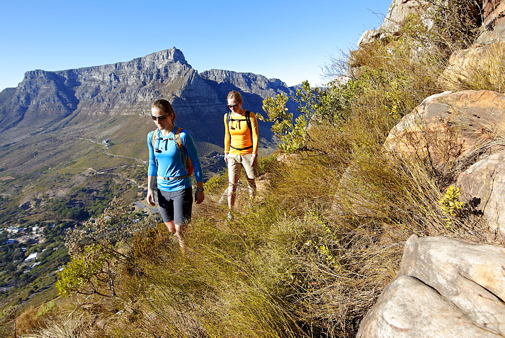 Katrin Schneider and Susann Scheller on a hike to the top of Lion's Head above the city of Cape Town. South Africa.