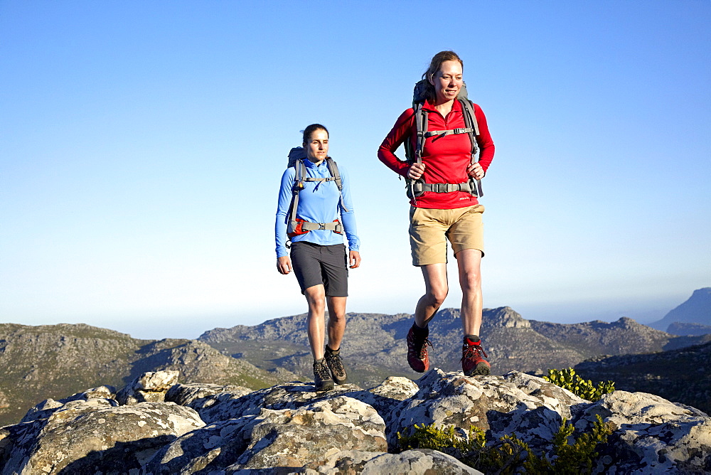 Katrin Schneider and Susann Scheller hiking on the Hoerikwaggo Trail from Cape Point to Table Mountain in Cape Town. South Africa.