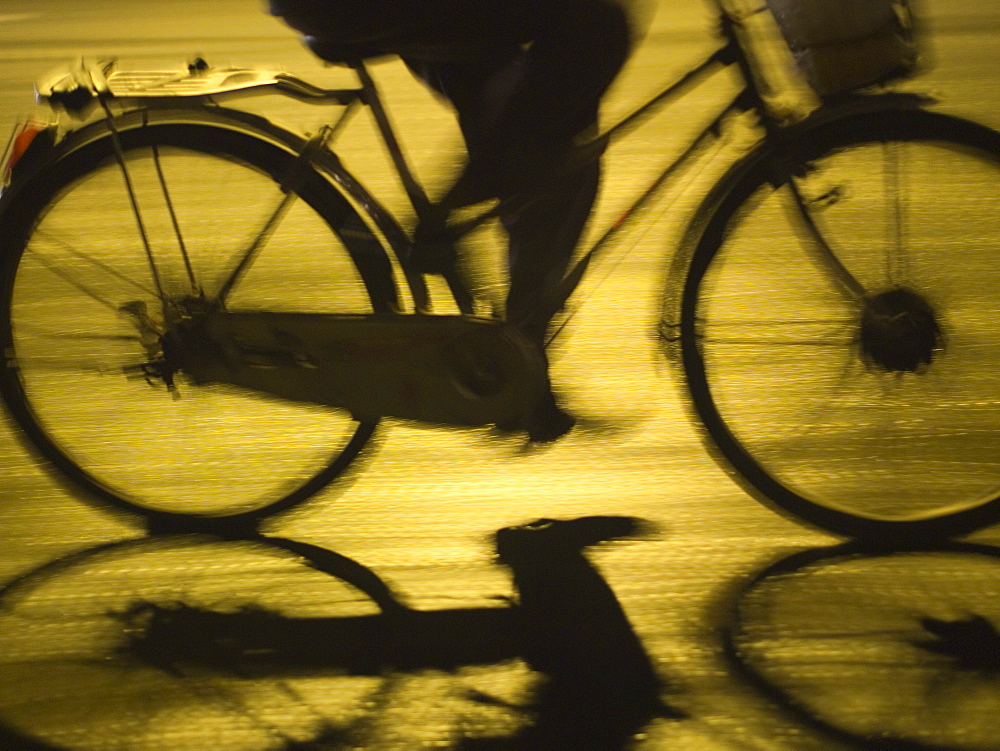 Bicycle traveller at night in Hoi An, Vietnam