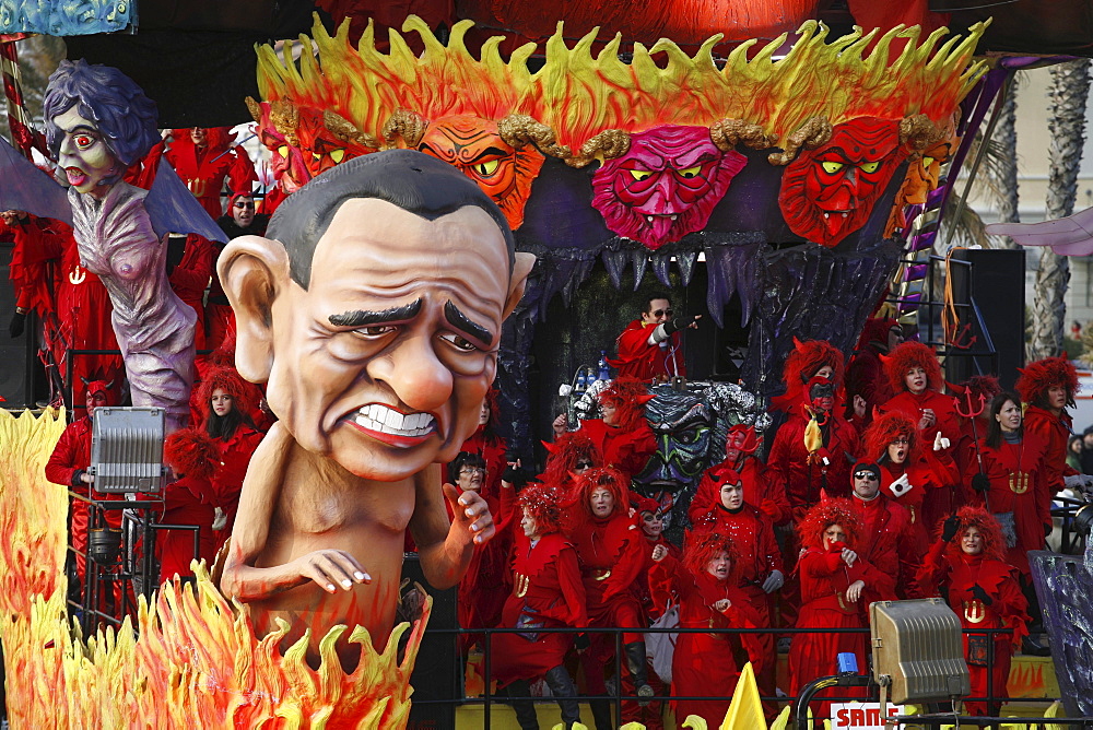 A float representing the Italian businessman and politician Silvio Berlusconi surrounded by masks during the Carnival of Viareggio.