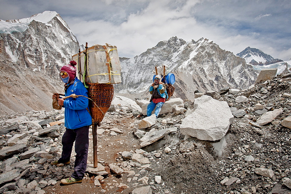 Two porters rest while delivering supplies to Everest Base Camp