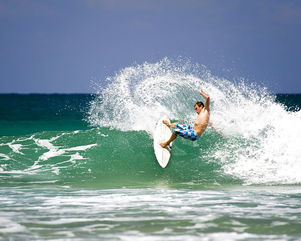 Surfing in Hanalei Bay on Kauai's north shore, Hawaii.