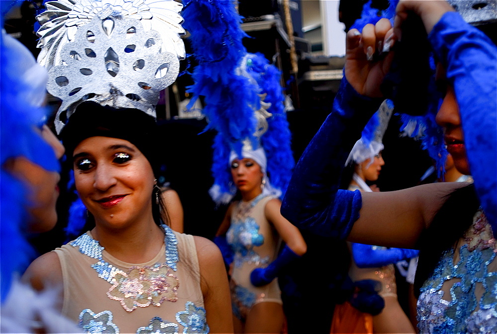 Costumed carnival dancers wait backstage in Merida, Venezuela.